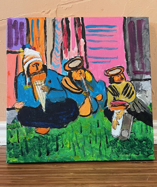 Three indigenous musicians playing their instruments